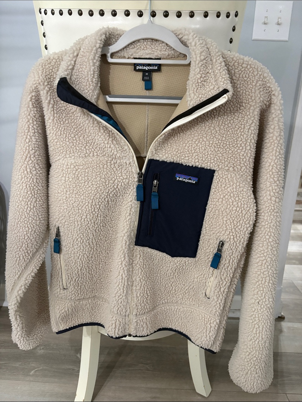 Patagonia woman’s Cream Sherpa Jacket with Navy Chest Pocket